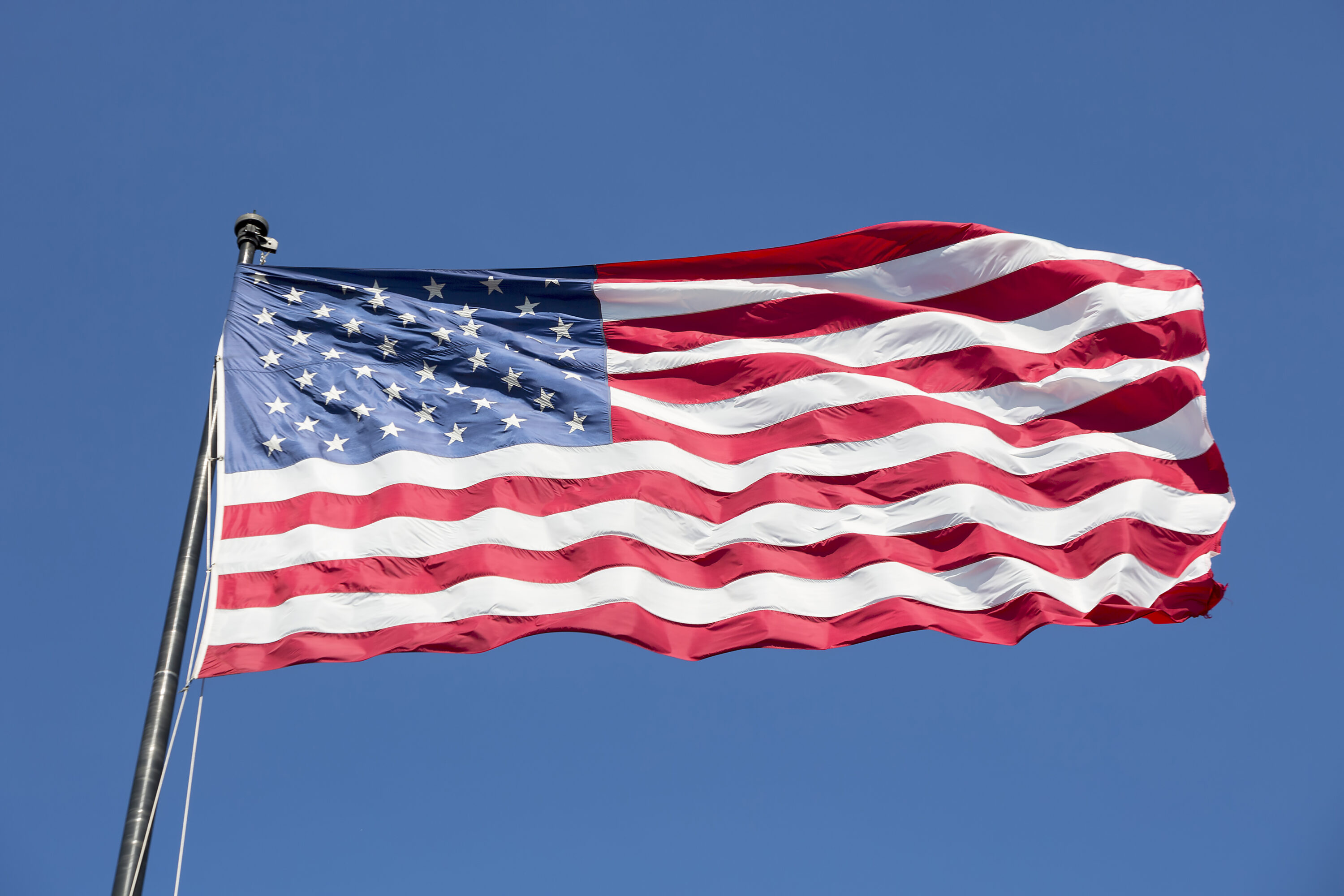 American flag on the blue sky Visado Estados Unidos